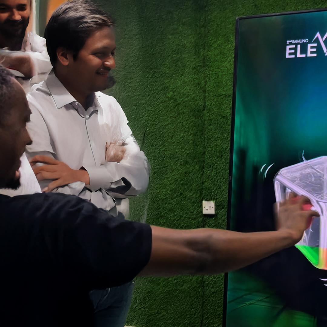 Guests playing Move Shake Pose AR game at a brand activation booth in Dubai event